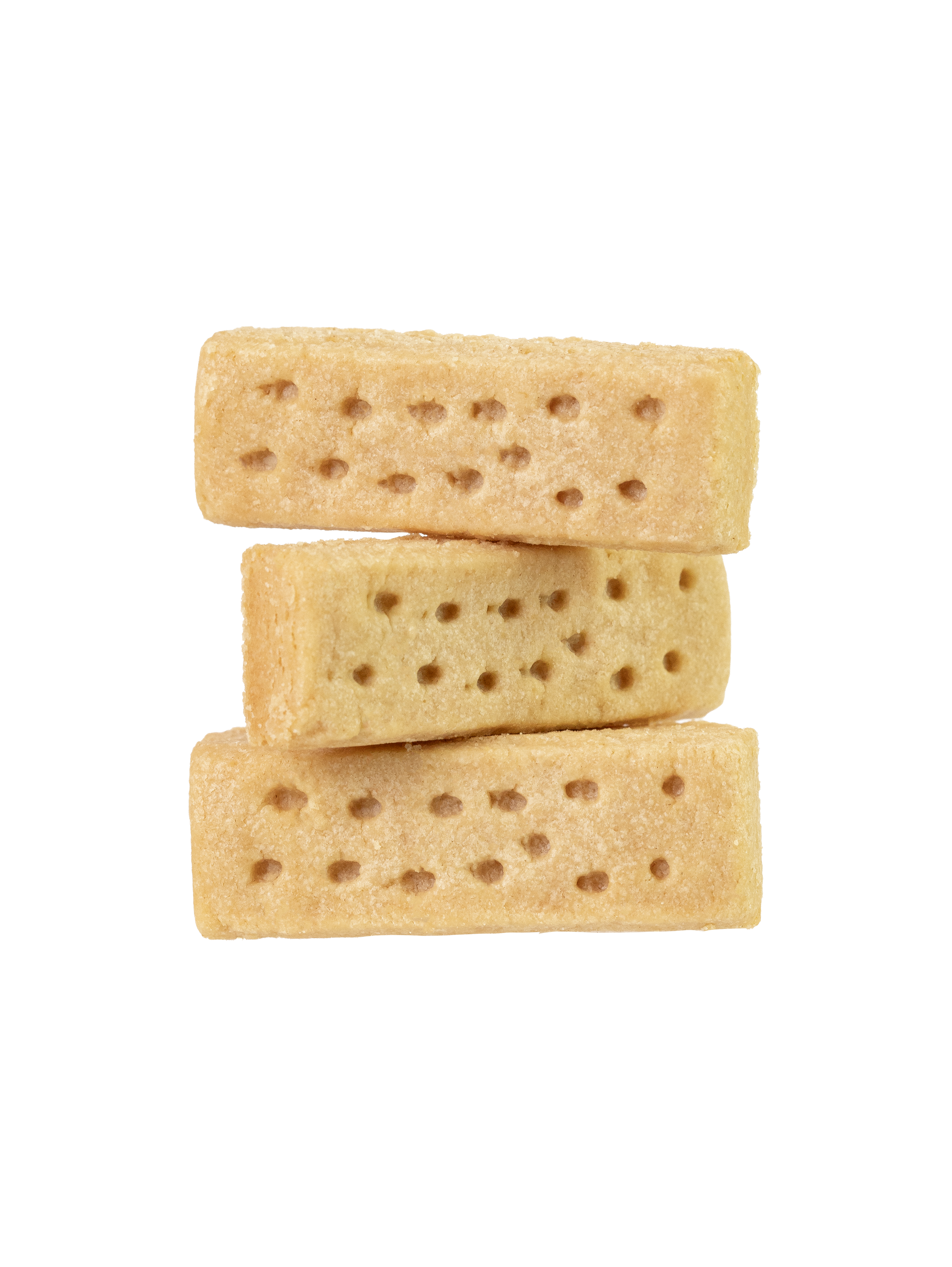 Stack of three uncooked gluten-free shortbread cookies with holes patterned on the surface