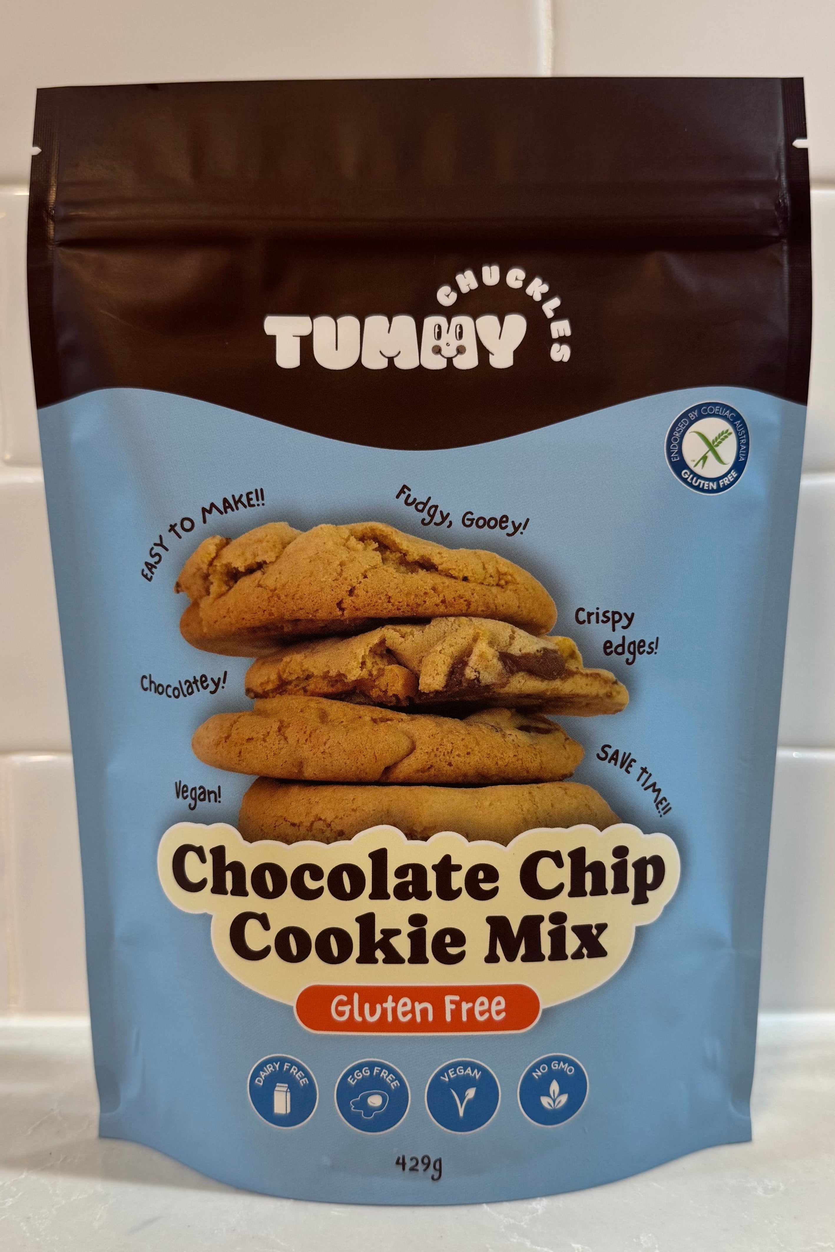 Tummy Chuckles gluten free Chocolate Chip Cookie Mix packaging on a white tiled background