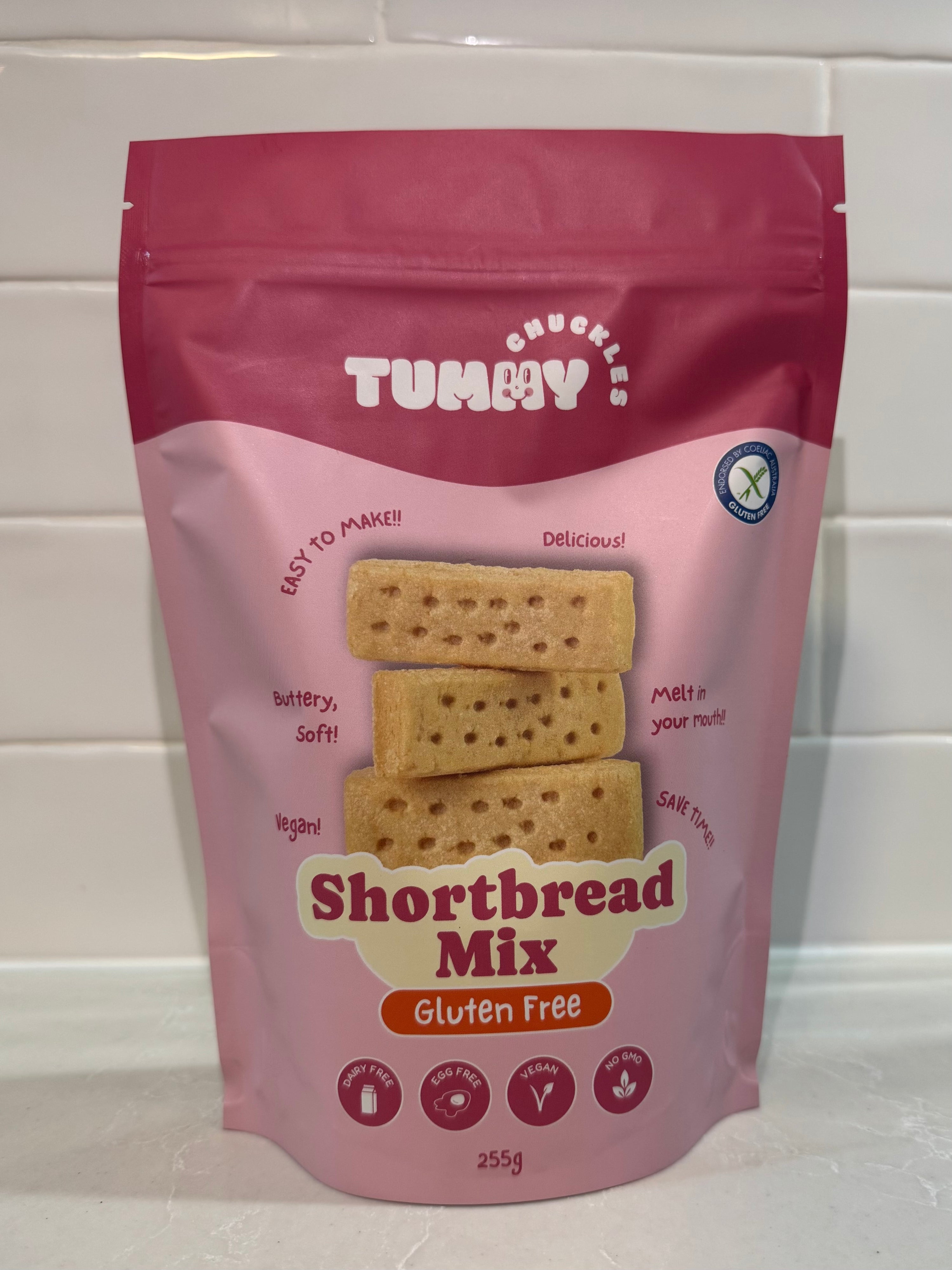 Packaging of Tummy Shortbread Mix on a white tiled background